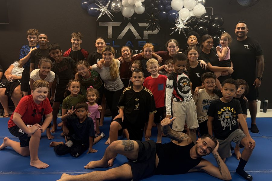 Kids and teens classes gathered together on the mats at The Tap Lab