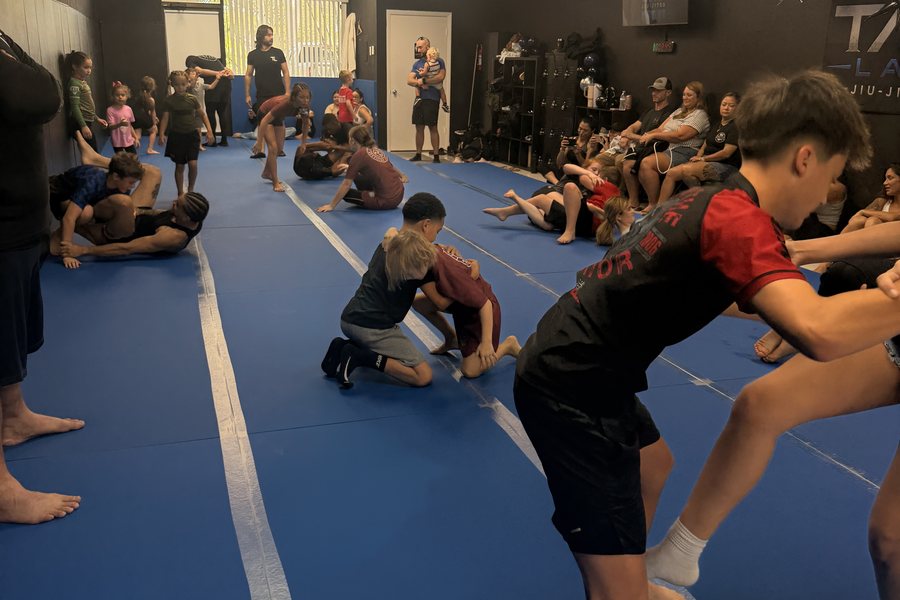 A class in progress on the mats at The Tap Lab, with parents watching from the side of the room